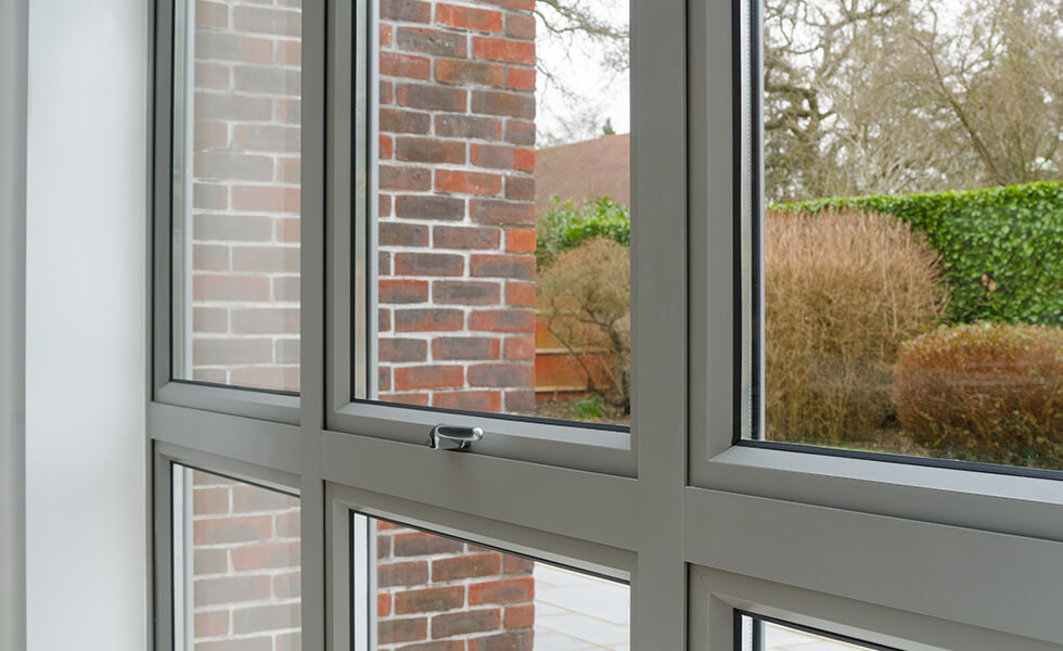 Grey aluminium casement window close up