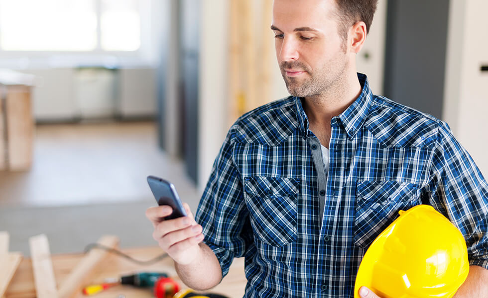 Installer checking his phone