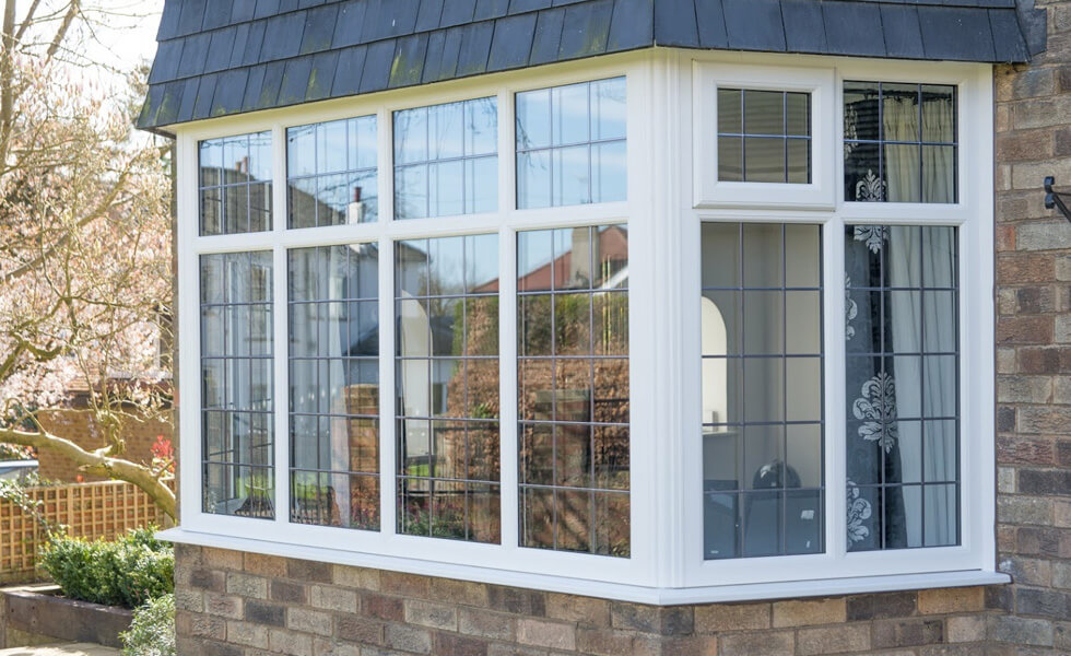 White uPVC bay windows with leaded glass