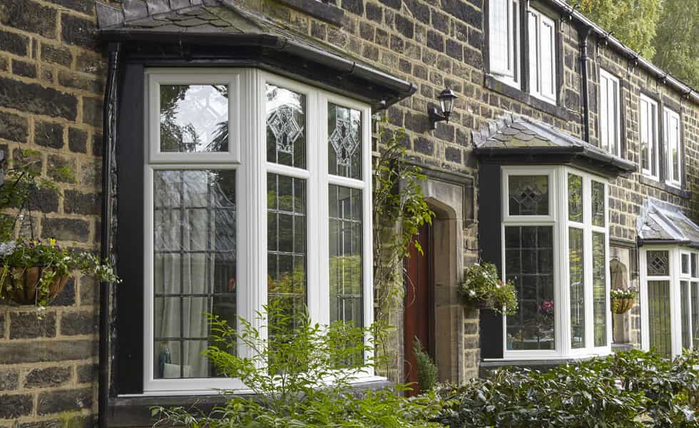 Tall white uPVC bow windows