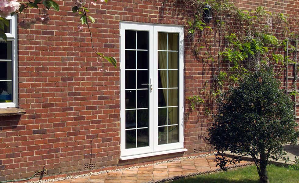 White UPVC french door with astragal bars