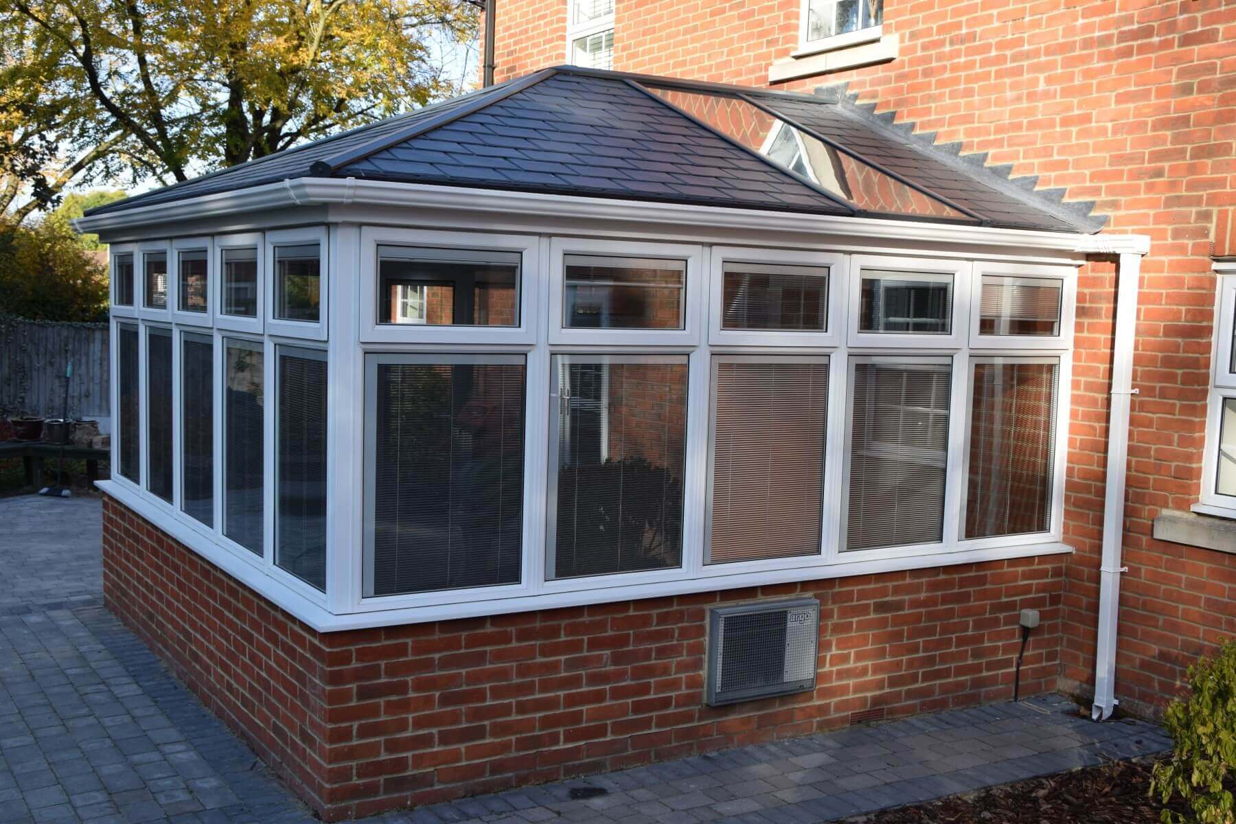 edwardian upvc conservatory with a brown tiled roof