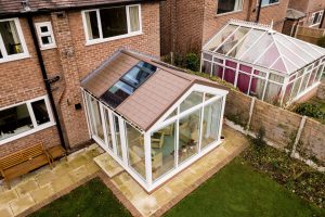 gable conservatory with a brown tiled roof