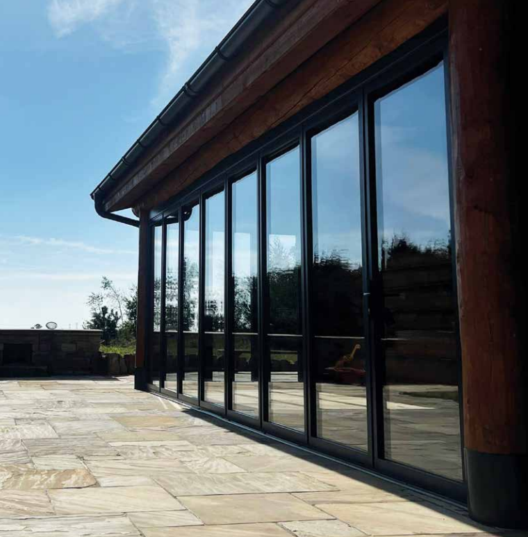 Quickslide's aluminium slide and fold doors, neatly closed on a patio 