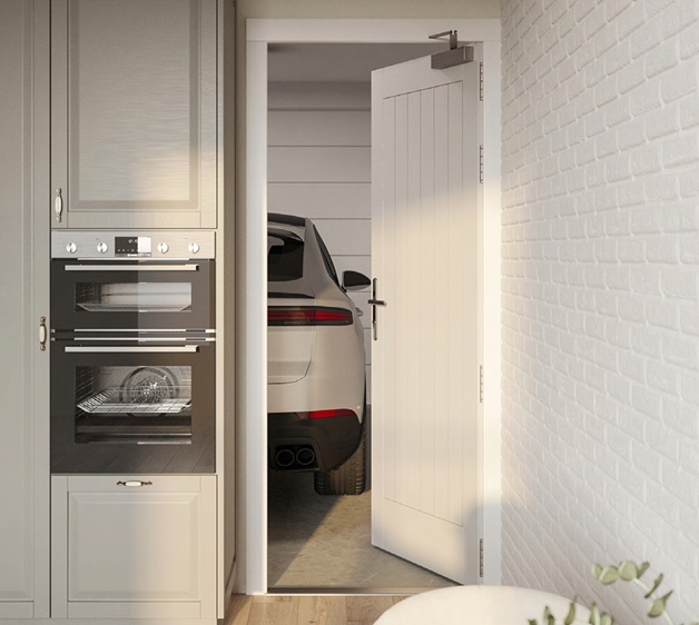 Discover a stylish fireproof entrance door connecting a modern kitchen with twin ovens to a garage with a white SUV. Safety and design combined.